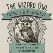 649500939_122120800569096999_2480207268217040811_n 1 Logo for The Wizard Owl Crêperie & Mercantile featuring an owl in a wizard hat and scarf.